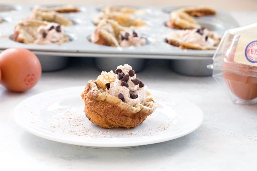 Mini Cinnamon Chocolate Chip German Pancakes with Cinnamon Whipped Cream -- bite-sized brunch made in a muffin tin! | wearenotmartha.com