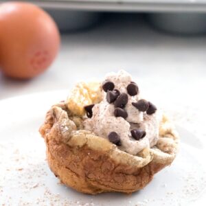 Mini Cinnamon Chocolate Chip German Pancakes with Cinnamon Whipped Cream -- bite-sized brunch made in a muffin tin! | wearenotmartha.com