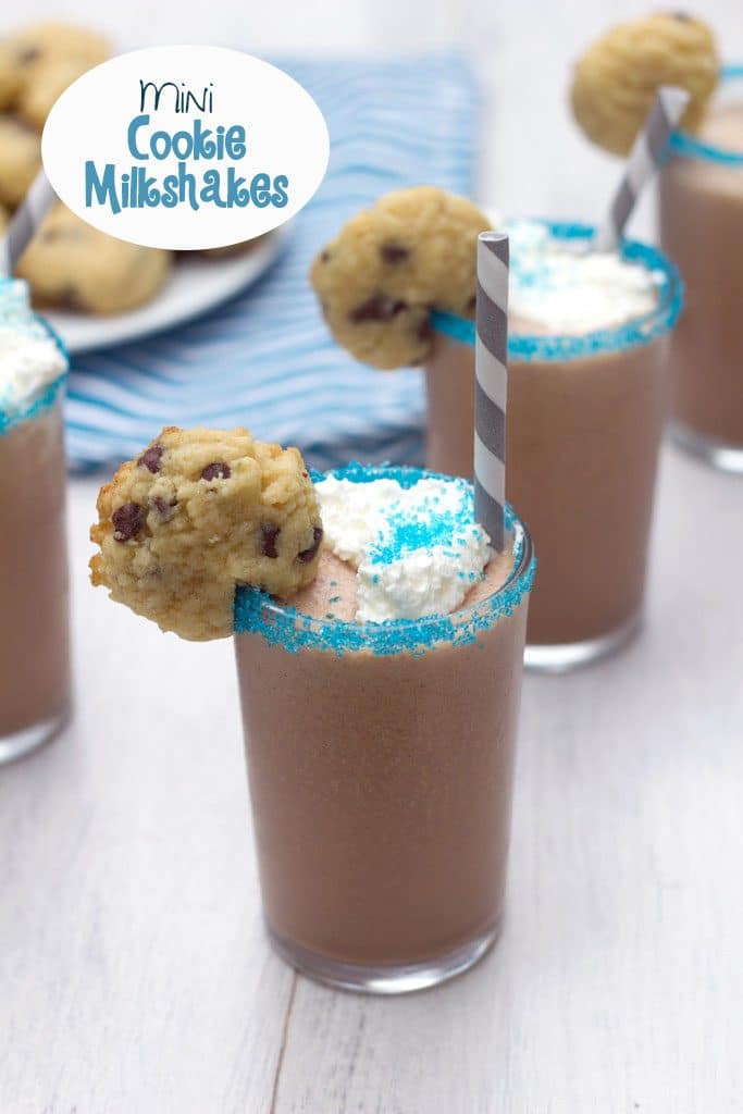 Overhead view of a row of mini milkshakes with blue sprinkles on rim and mini cookie garnish with recipe title at top
