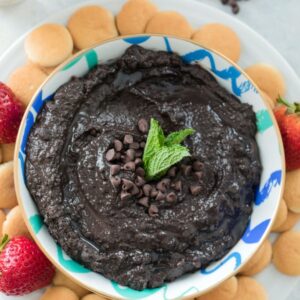 Mint Chocolate Hummus -- There's no reason to be skeptical of chocolate hummus! This Mint Chocolate Hummus can be served with fresh fruit or cookies and makes the perfect creamy dessert dip. Nobody will even guess that it's made with chickpeas | wearenotmartha.com