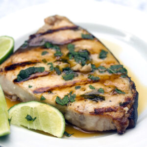 Grilled Mojito Swordfish -- Your favorite summer cocktail in fish form? This grilled Mojito Swordfish has all the flavors of the classic mojito and is so quick and easy to prepare | wearenotmartha.com
