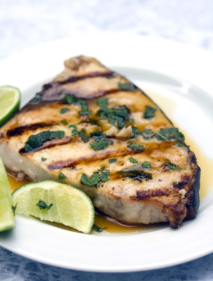 Grilled Mojito Swordfish -- Your favorite summer cocktail in fish form? This grilled Mojito Swordfish has all the flavors of the classic mojito and is so quick and easy to prepare | wearenotmartha.com