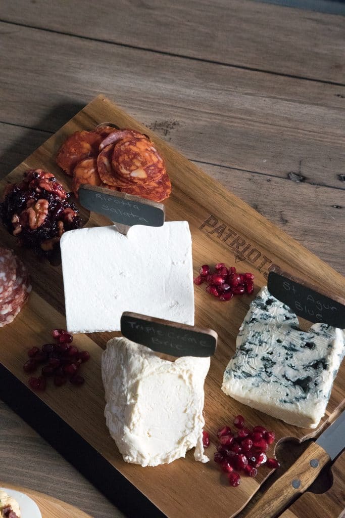 Cheese set out on NFL Homegate boards featuring the New England Patriots