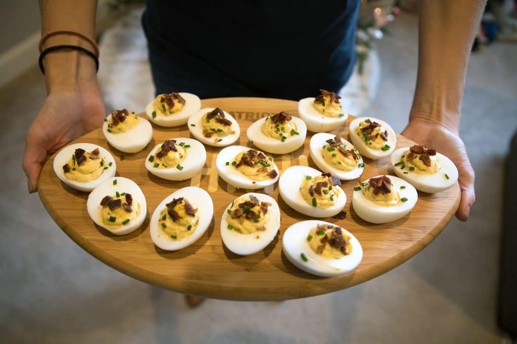 Deviled eggs on a New England Patriots NFL Homegating football-shaped candy board