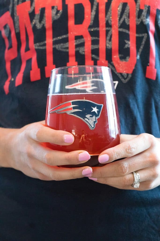 Strawberry Margarita Sangria featuring Straw-Ber-Rita poured in a New England Patriots wine glass from the NFL Homegate Collection