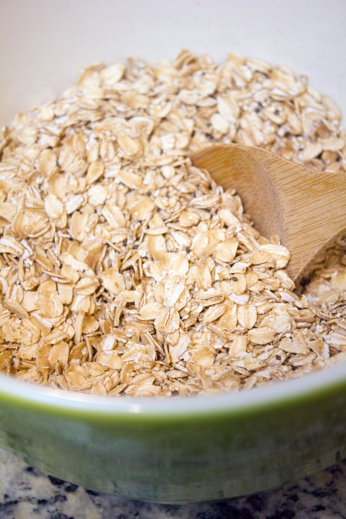 Overhead view of old-fashioned oats and quinoa in a mixing bowl