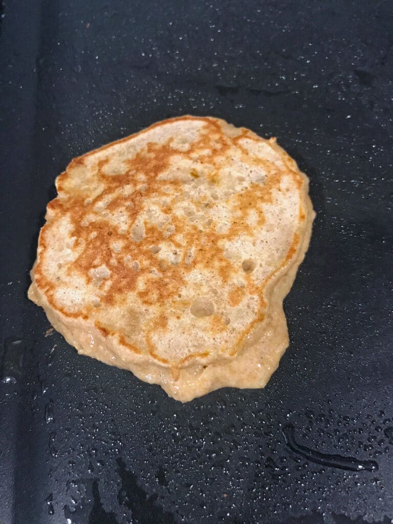 Pancake being cooked on skillet.