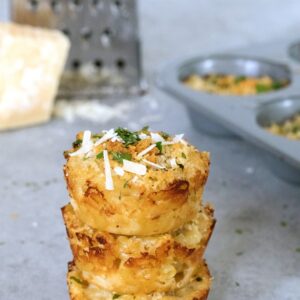 Parmigiano Reggiano Roasted Garlic Mac and Cheese Bites -- These mac and cheese bites are packed with flavor thanks to Parmigiano Reggiano cheese and roasted garlic. They're perfect for serving at parties or for a grab-and-go meal! | wearenotmartha.com #macandcheese #macandcheesebites #partyfood #appetizers #fingerfood #parmesancheese