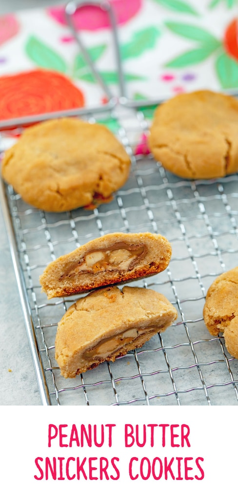 Peanut Butter Snickers Cookies -- These Peanut Butter Snickers Cookies look like a typical peanut butter cookie... But there's a delicious Snickers candy bar surprise inside each one | wearenotmartha.com #cookies #peanutbutter #snickers