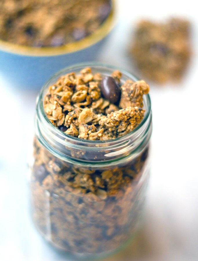 Peanut Butter Quinoa Chia Granola -- This tasty Peanut Butter Quinoa Chia Granola is the perfect mix of sweet and healthy. Peanut butter and chocolate-covered raisins are balanced out by a nutritious mix of oats, quinoa, and chia seeds | wearenotmartha.com