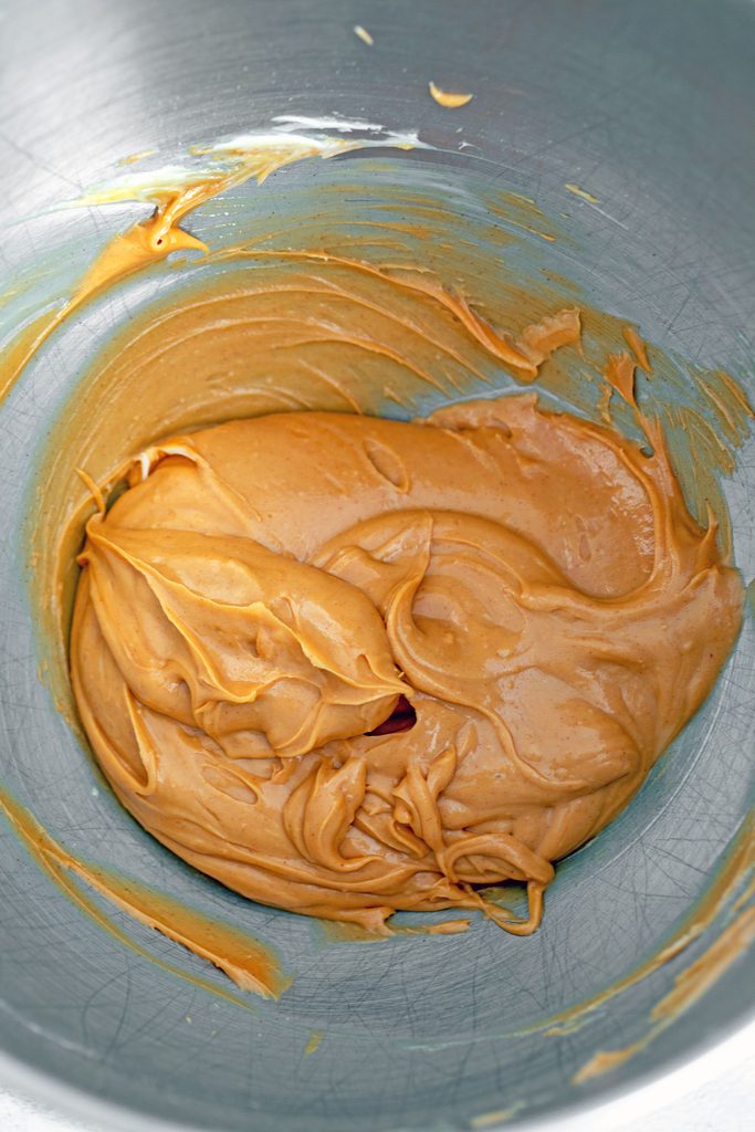 Overhead view of peanut butter filling for cookies in mixing bowl