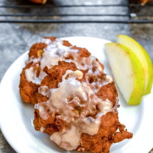 Pear Fritters -- You've probably had an apple fritter before... But have you ever had fritters made with pears? Let pears shine in these deliciously sweet fruit-packed Pear Fritters! | wearenotmartha.com #pears #pearfritters #pastry #peardesserts