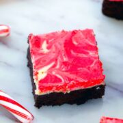 Peppermint Cheesecake Brownies -- These Peppermint Cheesecake Brownies are packed with festive peppermint flavor with a dreamy red and white swirl, making them the perfect holiday party dessert | wearenotmartha.com