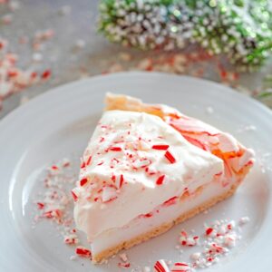 Peppermint Pavlova with White Chocolate Whipped Cream -- The underrated pavlova is an easy-to-make dessert perfect for all kinds of occasions. This version is a Peppermint Pavlova with White Chocolate Whipped Cream and will be the hit of all your holiday parties! | wearenotmartha.com