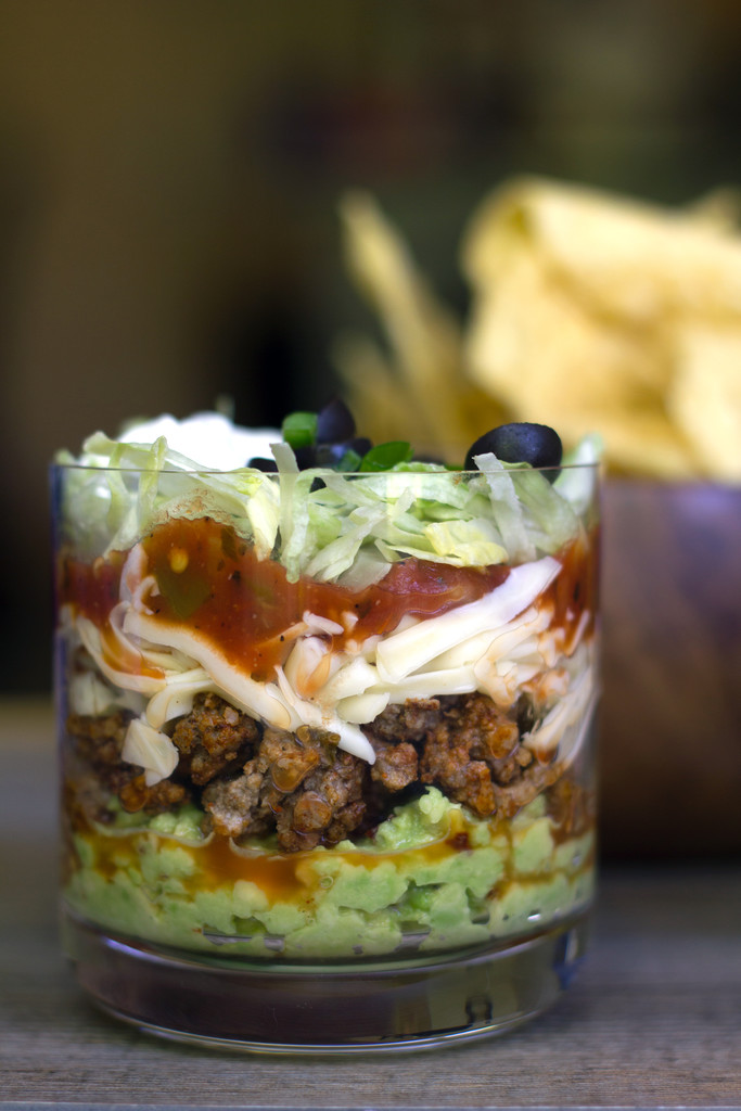 Mini Taco Dips -- You'll never have to fear double dipping again with these Mini Taco Dips! The perfect food to serve at a cocktail party or BBQ, everyone will love getting their own personal-sized taco dip | wearenotmartha.com