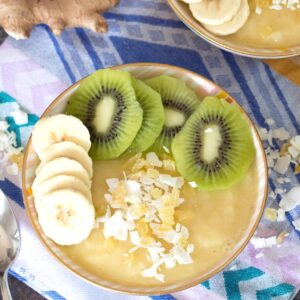 Pineapple Banana Ginger Smoothie Bowl -- This simple-to-make Pineapple Banana Ginger Smoothie Bowl is the perfect way to start your day. Not only is it packed with vitamins and antioxidants, but it's like a vacation in a bowl! | wearenotmartha.com