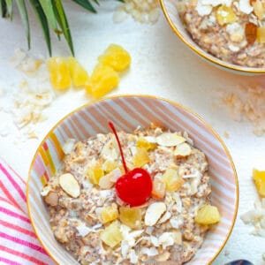 Bircher muesli is a cold breakfast cereal packed with grains and dried fruit that can be customized to your tastes. This Piña Colada Bircher Muesli is packed with whole grains and pineapple and coconut flavors and feels like a tropical vacation first thing in the morning... The only thing missing is the rum!