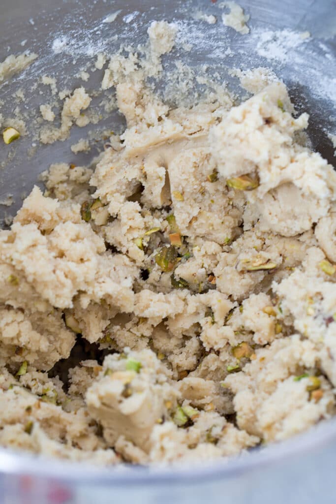 Shortbread cookie dough with crushed pistachios mixed in