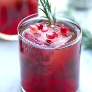 Pomegranate Rosemary Gin Sparkler -- Packed with pomegranate juice, rosemary simple syrup, and gin, this pomegranate and gin cocktail will help you get you through the long winter days | wearenotmartha.com