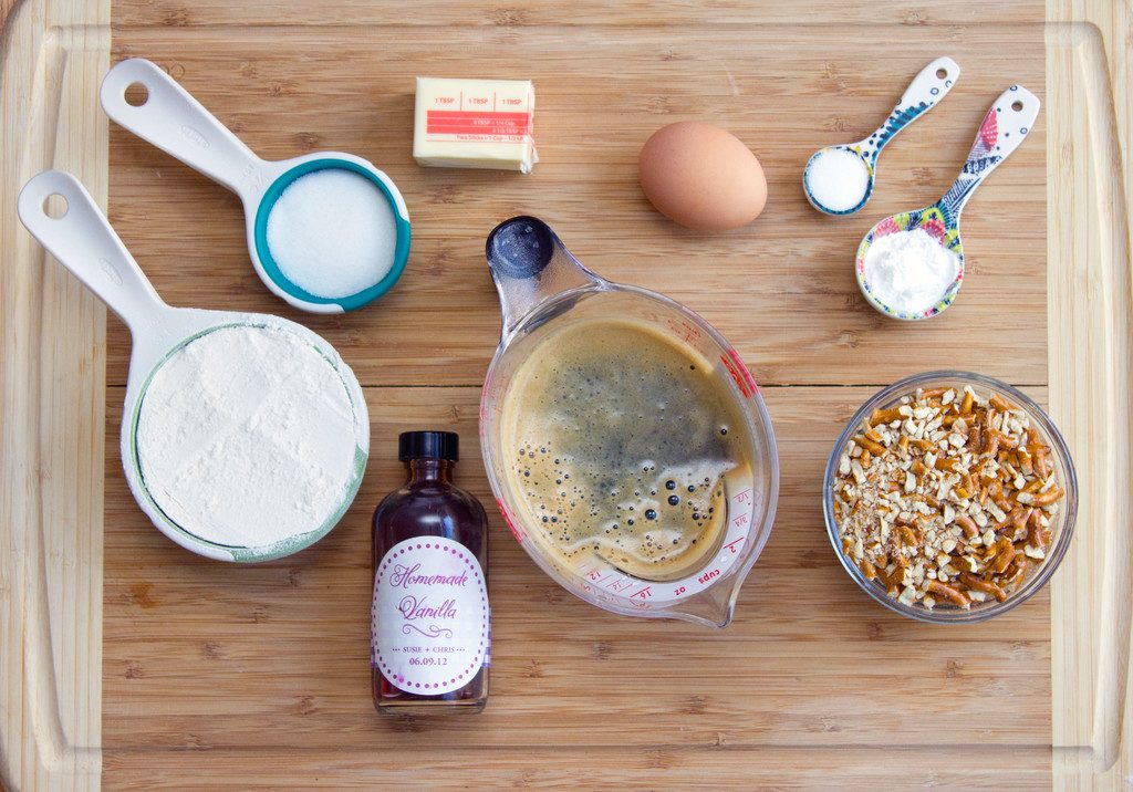 Flat lay showing all of the ingredients needed for Pretzel Stout Pancakes with Toffee Sauce