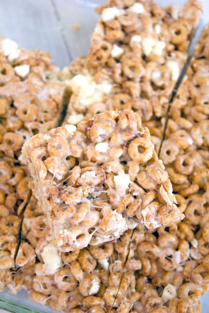 Overhead view of pumpkin spice Cheerios marshmallow treats cut into squares in pan