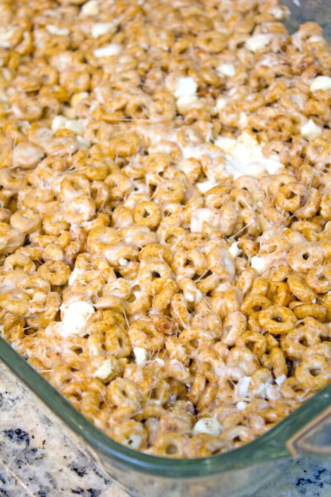 Cheerio and marshmallow mixture resting in pan