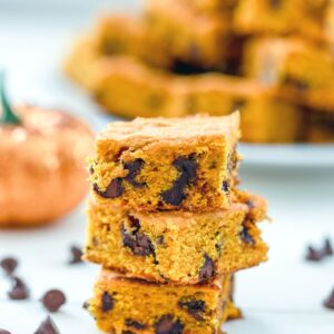 Pumpkin Chocolate Chip Squares -- If you're looking for a go-to pumpkin recipe you'll make over and over, these pumpkin chocolate chip squares are it. I have yet to met a person who doesn't rave about these pumpkin bars every time I make them! | wearenotmartha.com