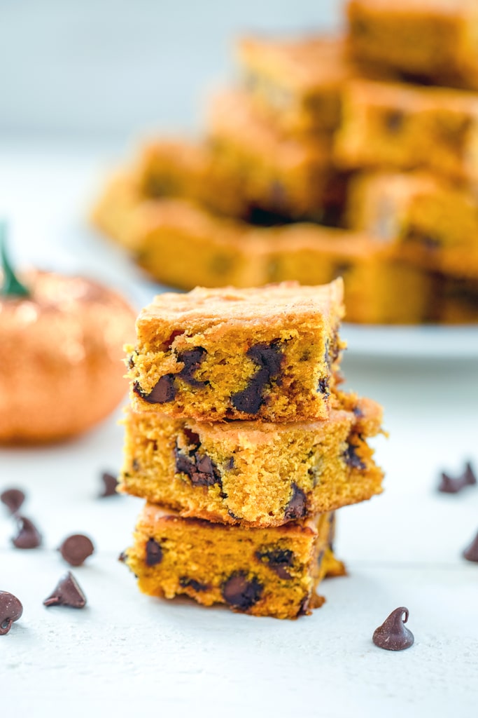 Pumpkin Chocolate Chip Squares -- If you're looking for a go-to pumpkin recipe you'll make over and over, these pumpkin chocolate chip squares are it. I have yet to met a person who doesn't rave about these pumpkin bars every time I make them! | wearenotmartha.com