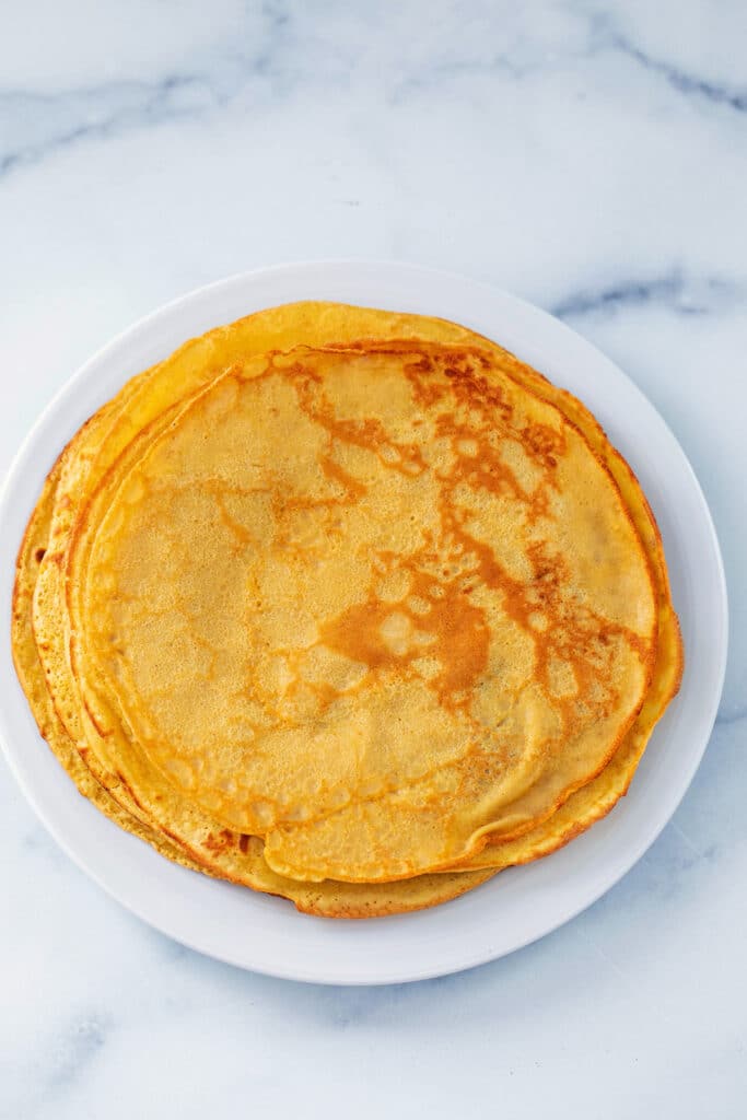 Overhead view of pumpkin crepes on plate