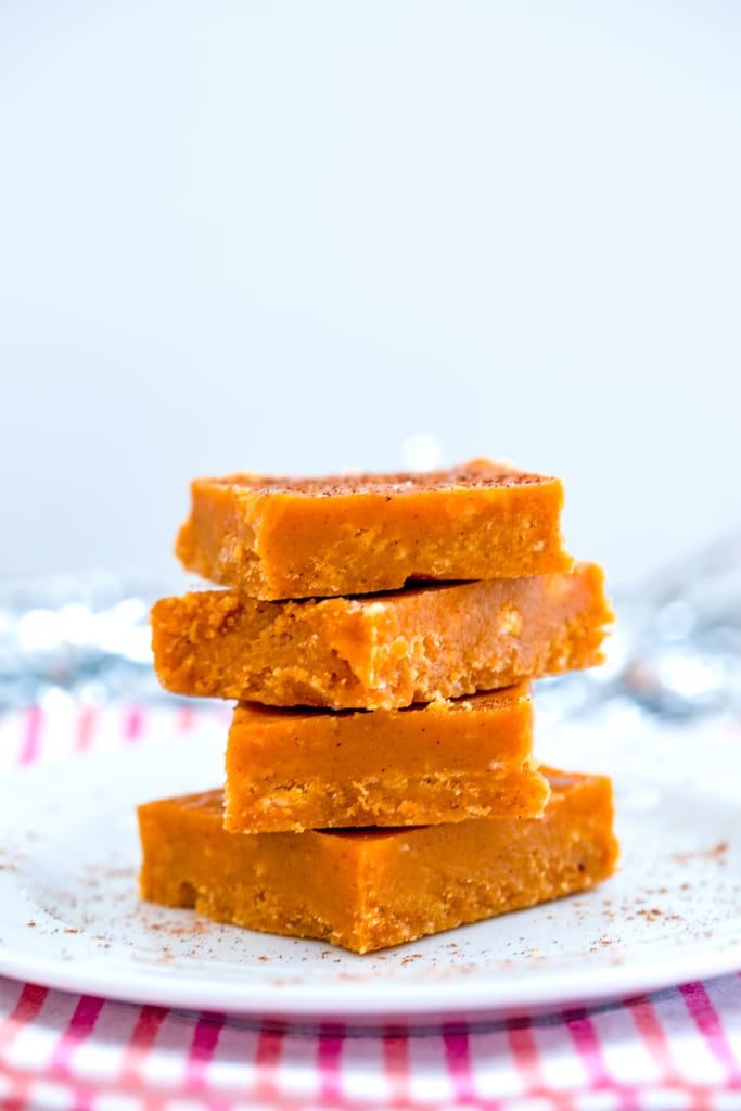 Stack of pumpkin fudge on a white plate.