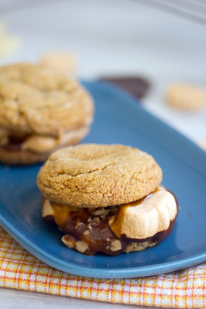 Pumpkin Gingersnap S'mores -- Pumpkin gingersnaps, pumpkin spice marshmallows, chocolate, caramel, and toffee make for the perfect fall s'more! | wearenotmartha.com