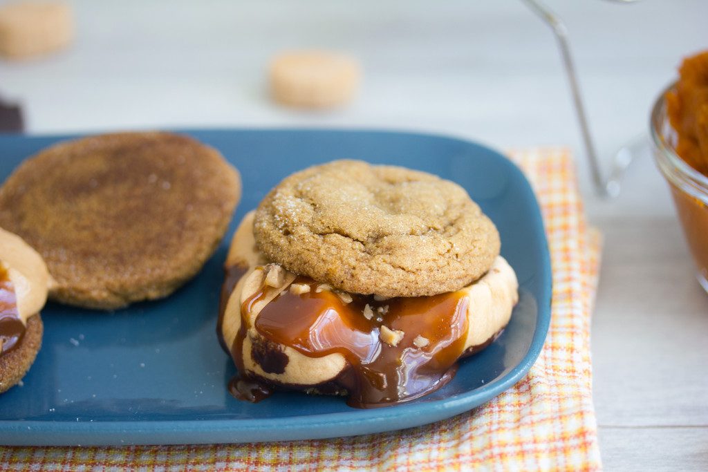 Pumpkin Gingersnap S'mores -- Pumpkin gingersnaps, pumpkin spice marshmallows, chocolate, caramel, and toffee make for the perfect fall s'more! | wearenotmartha.com