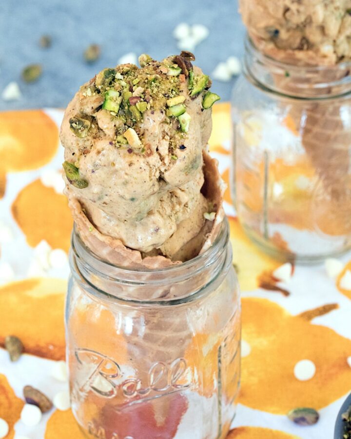 Pumpkin Ice Cream with Pistachio Swirl -- This pumpkin ice cream is made even better with white chocolate chips and a pistachio swirl. You'll find yourself craving homemade ice cream all fall long! | wearenotmartha.com