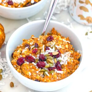 Pumpkin Muesli -- This Pumpkin Muesli is the perfect solution to dark fall and winter mornings when you need some extra motivation to get out of bed. Made with lots of healthy grains, pumpkin puree, dried cranberries, and apple cider, it will keep full all morning long | wearenotmartha.com