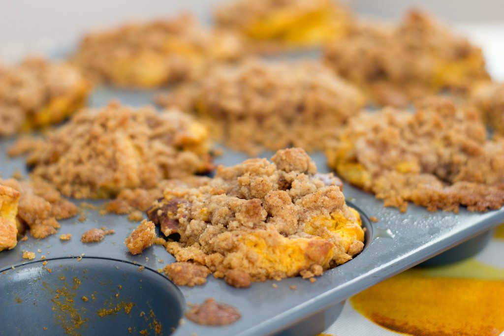 Landscape overhead view of pumpkin spice french toast muffins in tin just out of the oven 