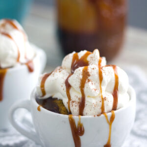 Pumpkin Spice Latte Mug Cake -- These Pumpkin Spice Latte Mug Cakes are quick to whip up and only take one minute to bake in the microwave. Pumpkin mug cake will most definitely get you in a cozy fall spirit | wearenotmartha.com