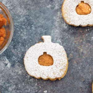 Pumpkin Spice Linzer Cookies -- These Pumpkin Spice Linzer Cookies are filled with pumpkin cinnamon buttercream and are the perfect pumpkin-shaped fall cookie | wearenotmartha.com