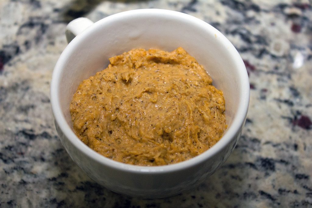 Overhead view of batter in white mug