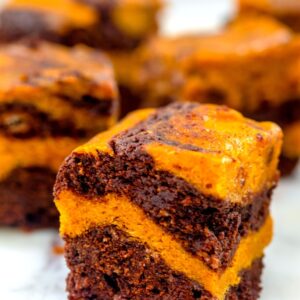 Pumpkin Swirl Brownies -- You can't beat desserts that combine pumpkin and chocolate in the fall and these Pumpkin Swirl Brownies mix them in the prettiest way | wearenotmartha.com