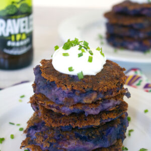 Purple Mashed Potato Pancakes with Garlic and Pancetta -- Mashed potato pancakes need no improvements, but they're way more fun when made with purple potatoes, garlic, pancetta, and cheddar cheese. These Purple Mashed Potato Pancakes with Garlic and Pancetta should be served at every cocktail party | wearenotmartha.com