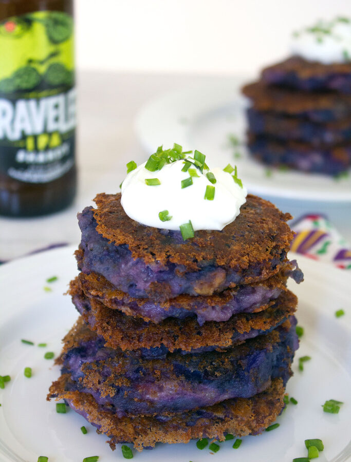 Purple Mashed Potato Pancakes with Garlic and Pancetta -- Mashed potato pancakes need no improvements, but they're way more fun when made with purple potatoes, garlic, pancetta, and cheddar cheese. These Purple Mashed Potato Pancakes with Garlic and Pancetta should be served at every cocktail party | wearenotmartha.com