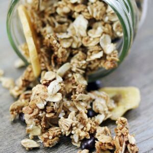Quinoa Granola with Dark Chocolate Pomegranate -- Homemade granola is one of the easiest breakfasts or snacks and this recipe for quinoa granola is no different, except it has the benefit of an extra protein boost! Dark chocolate pomegranates and banana chips add a little sweetness and fun | wearenotmartha.com