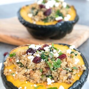 Quinoa-Stuffed Acorn Squash -- The perfect healthy dinner for the holiday season and beyond. Tender acorn squash with a delicious quinoa and mushroom filling topped with feta cheese is filling and incredibly satisfying | wearenotmartha.com