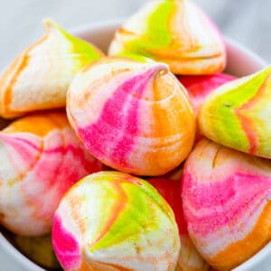 Closeup view of rainbow sherbet meringues in a bowl