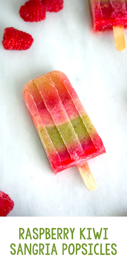 Sangria Popsicles -- What's better than sangria on a hot summer day? Sangria popsicles packed with raspberry and kiwi, perfectly refreshing and delicious! | wearenotmartha.com #sangria #popsicles #boozy