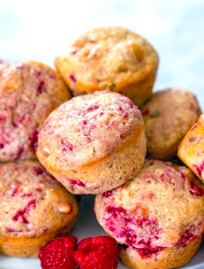 Raspberry, Mango, and Ginger Muffins -- These Raspberry, Mango, and Ginger Muffins are packed with bright notes of fruit and will bring lots of sunshine to your morning breakfast routine! | wearenotmartha.com