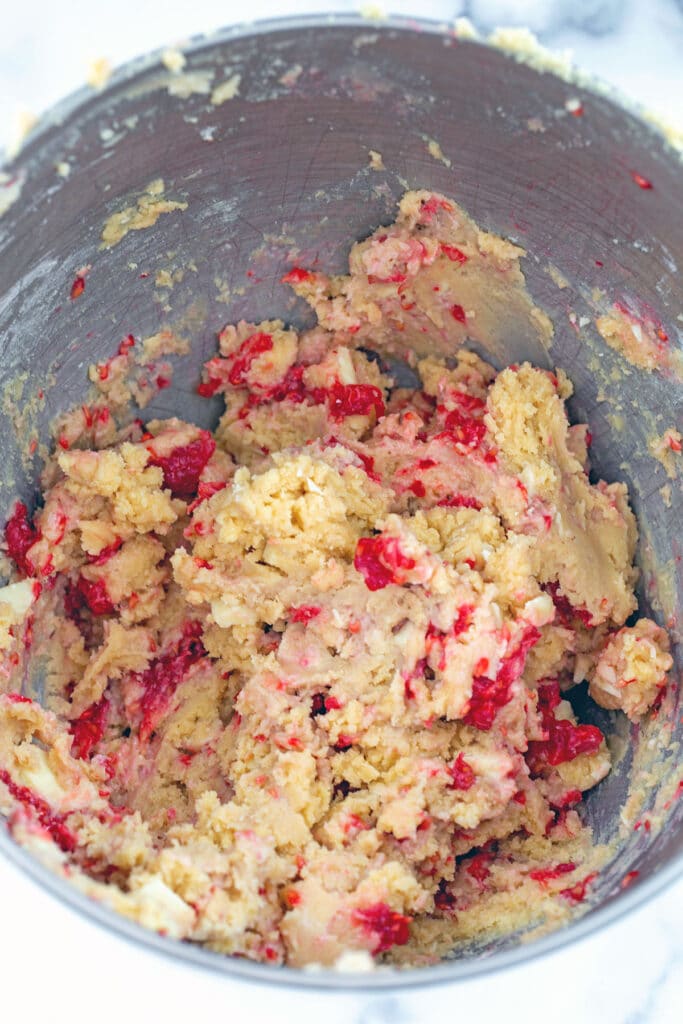 Raspberry white chocolate cookie dough in mixing bowl.