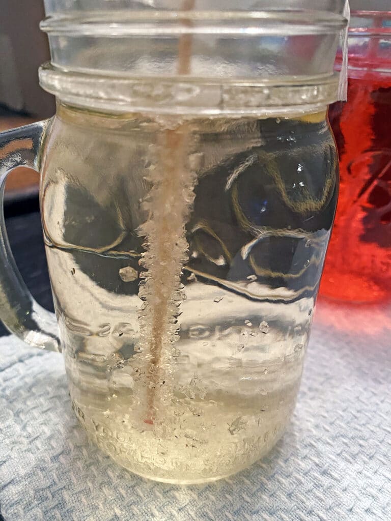 Rock candy crystals forming in jar after 3 days