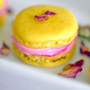 Summer in macaron form? These Rose Lemonade Macarons have a light and refreshing lemon flavor and are combined with a deliciously bright rose buttercream.