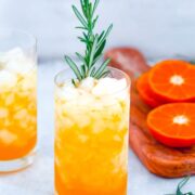 Rosemary Tangerine Cooler -- Caramelized citrus and herbs mix together for this delightful rum-based Tangerine and Rosemary Cocktail | wearenotmartha.com